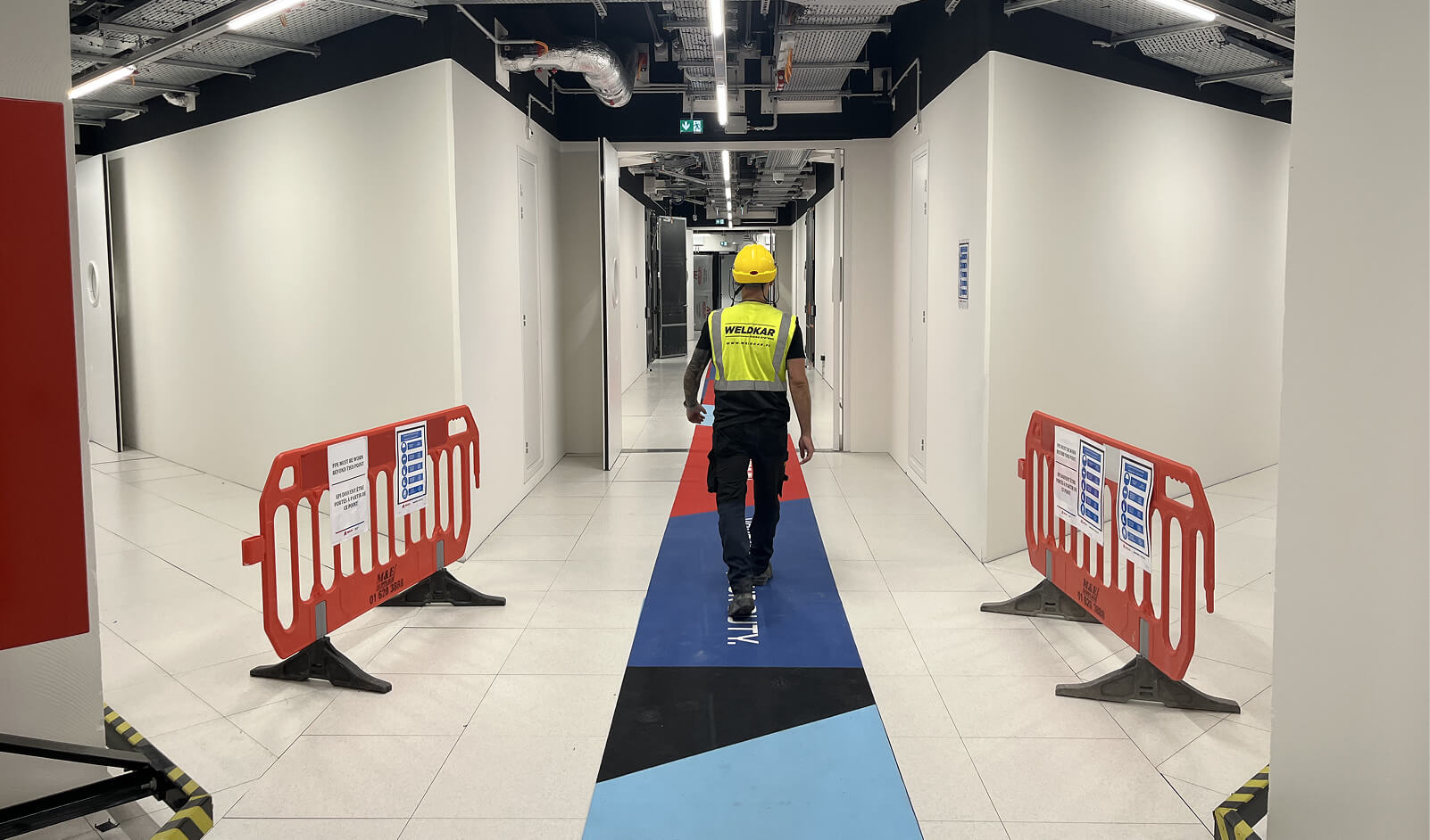 Weldkar specialist in modern data center corridor